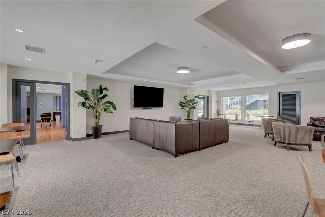 8925 W Flamingo Road, #111, Las Vegas, NV 89147 Recessed tray ceilings and wall-to-wall carpeting define this versatile community gathering space.