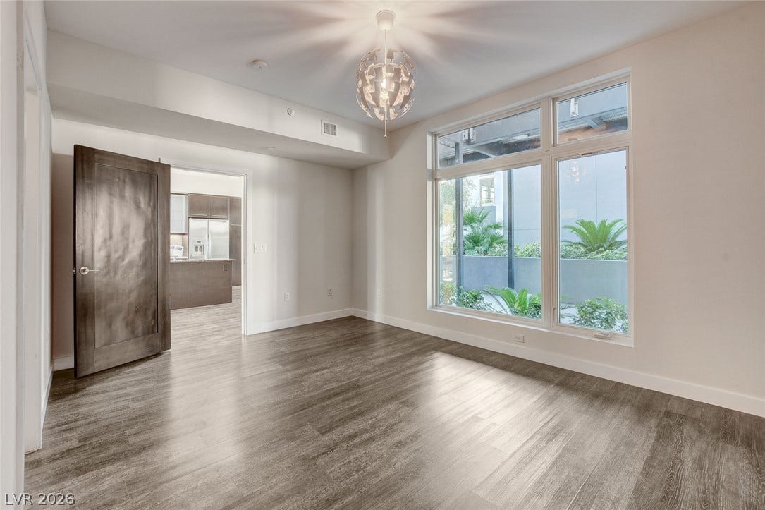 8925 W Flamingo Road, #111, Las Vegas, NV 89147 Gleaming hardwood floors and a generous window frame views of the landscaped courtyard.