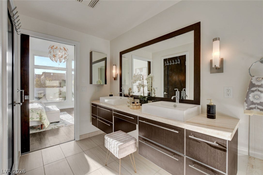 8925 W Flamingo Road, #111, Las Vegas, NV 89147 Clean lines and a spacious dual vanity define this contemporary master bathroom.