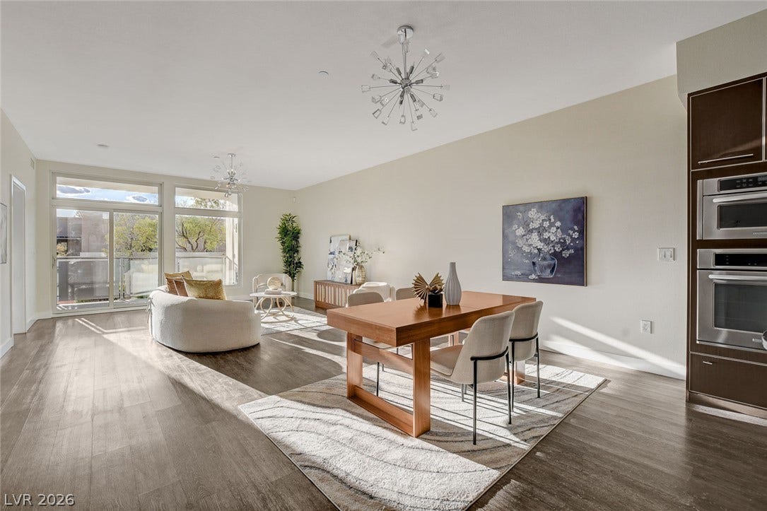 8925 W Flamingo Road, #111, Las Vegas, NV 89147 Gleaming wood floors run through this airy space seamlessly connecting dining and living zones.
