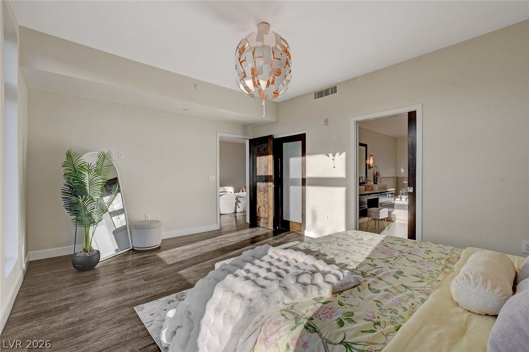 8925 W Flamingo Road, #111, Las Vegas, NV 89147 Gleaming hardwood floors and a spacious layout define this modern master suite.