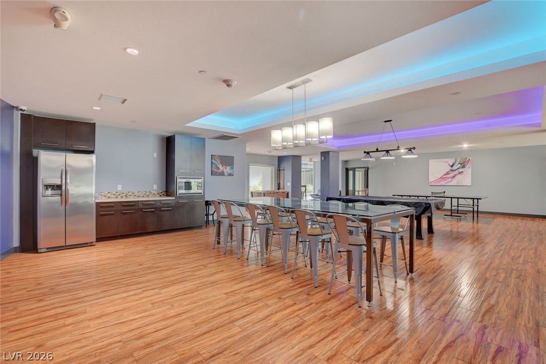 8925 W Flamingo Road, #111, Las Vegas, NV 89147 Gleaming wood floors and modern tray ceilings anchor this spacious recreational club room with kitchenette.
