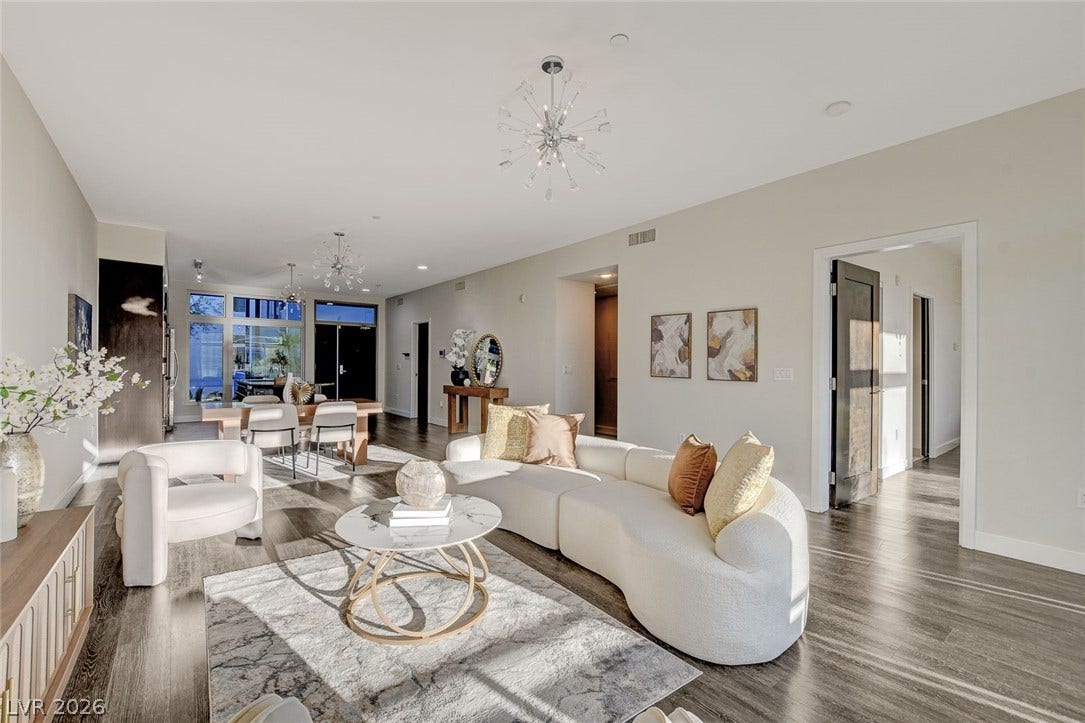 8925 W Flamingo Road, #111, Las Vegas, NV 89147 Gleaming hardwood floors and a modern open layout define this inviting main-level living space.
