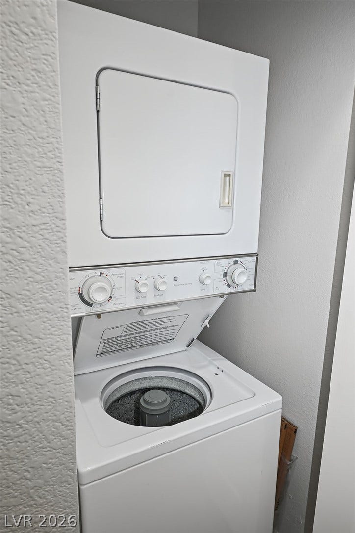 47 E Agate Avenue, #301, Las Vegas, NV 89123 A compact stacked laundry unit fits neatly into a dedicated utility closet.