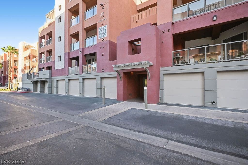 47 E Agate Avenue, #301, Las Vegas, NV 89123 Multi-level modern exterior architecture integrates secure private garage bays beneath upper-level glass balconies.
