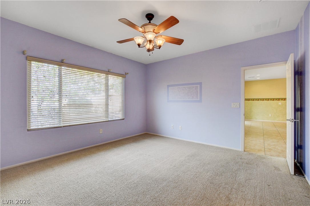 2612 Rock Pigeon Avenue, North Las Vegas, NV 89084 Generous windows fill this versatile bedroom with soft natural light.