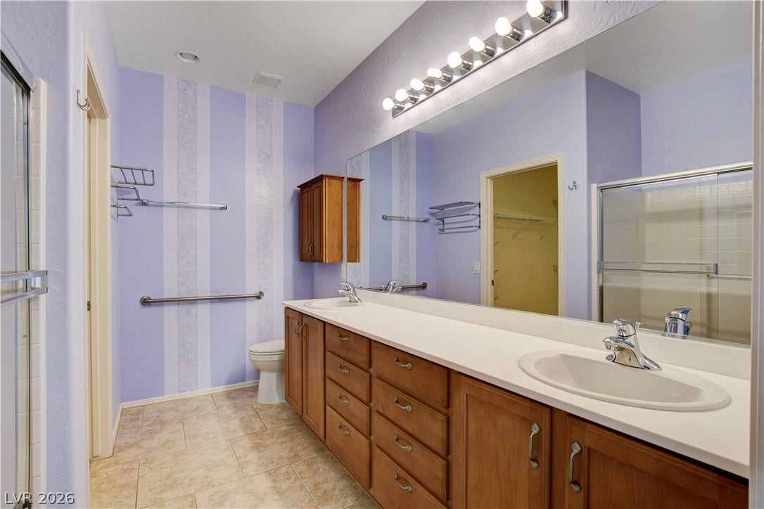 2612 Rock Pigeon Avenue, North Las Vegas, NV 89084 A spacious vanity with double sinks highlights this functional bathroom.