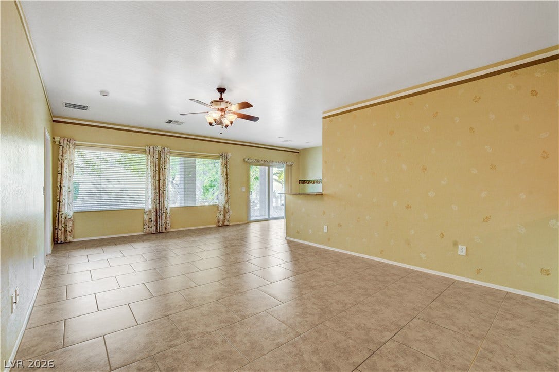 2612 Rock Pigeon Avenue, North Las Vegas, NV 89084 An open floorplan matches neutral tile flooring with ample natural light from large windows.