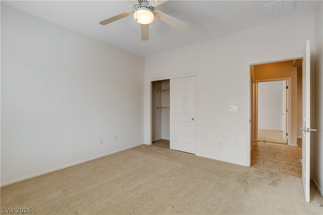 2612 Rock Pigeon Avenue, North Las Vegas, NV 89084 Plush carpeting and a neutral color palette define this versatile bedroom space.
