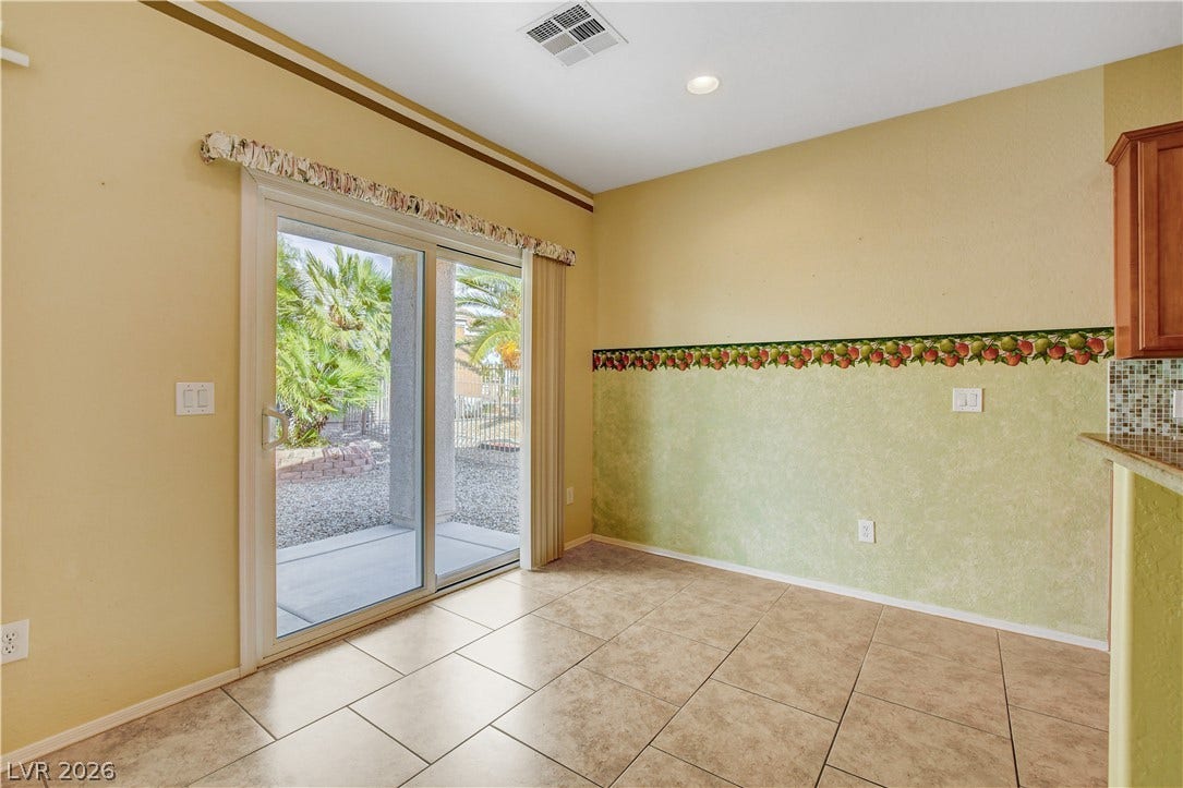2612 Rock Pigeon Avenue, North Las Vegas, NV 89084 Sliding glass doors open directly to the outdoor patio from this tiled dining area.