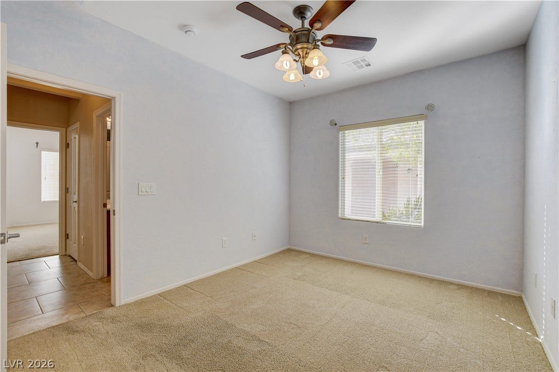 2612 Rock Pigeon Avenue, North Las Vegas, NV 89084 Plush carpeting and abundant natural light create a welcoming and cozy interior atmosphere.