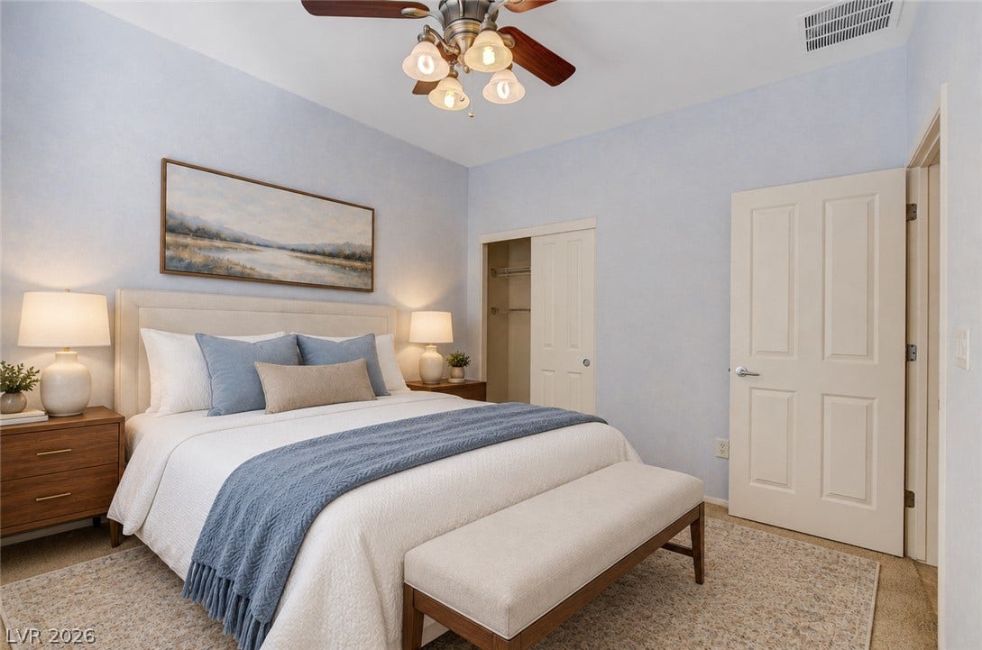 2612 Rock Pigeon Avenue, North Las Vegas, NV 89084 Smooth carpeting and light-filled plaster walls define this restful sleeping space.