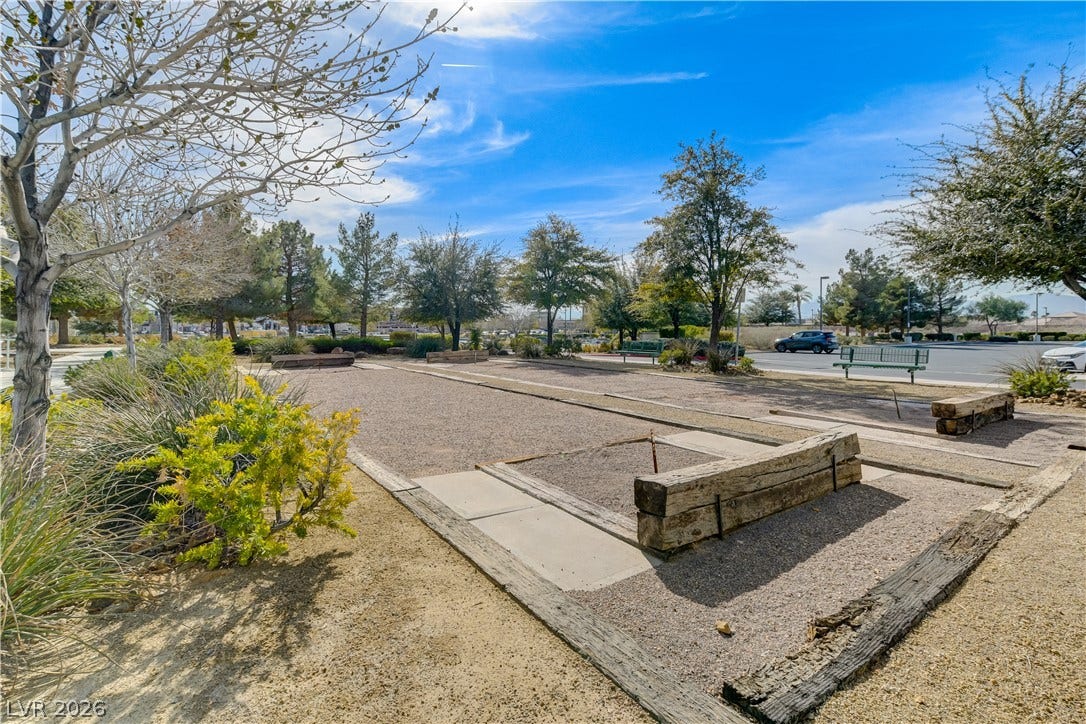 2612 Rock Pigeon Avenue, North Las Vegas, NV 89084 Well-maintained community bocce courts sit surrounded by mature desert landscaping under a bright sky.