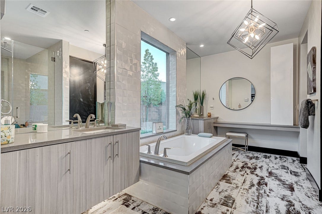 5 HIGHLAND COVE Lane, Henderson, NV 89011 This spacious bathroom offers a relaxing soaking tub and ample vanity space.