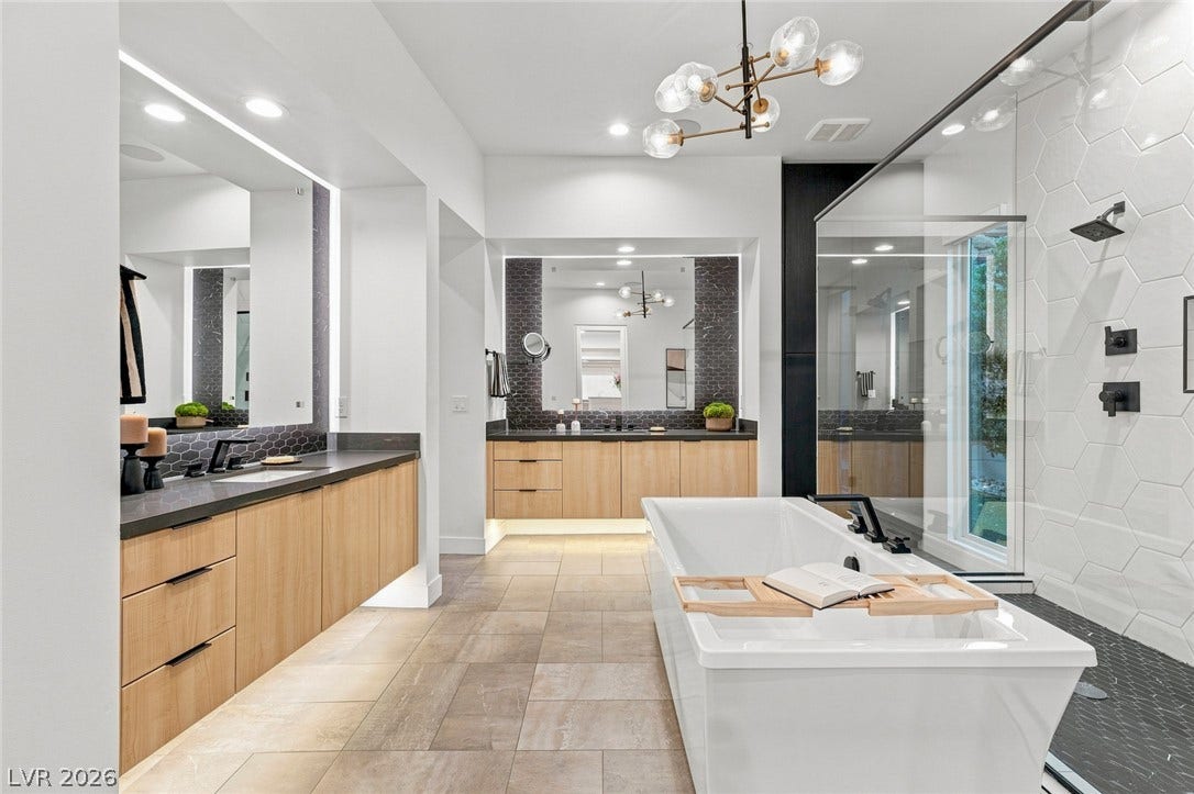 Clean lines and a freestanding tub define this contemporary primary bath sanctuary.