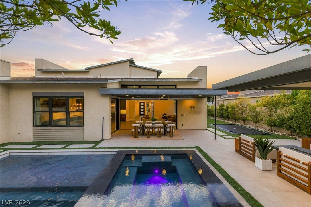 A sparkling geometric pool anchors this modern backyard retreat with seamless indoor-outdoor transition.