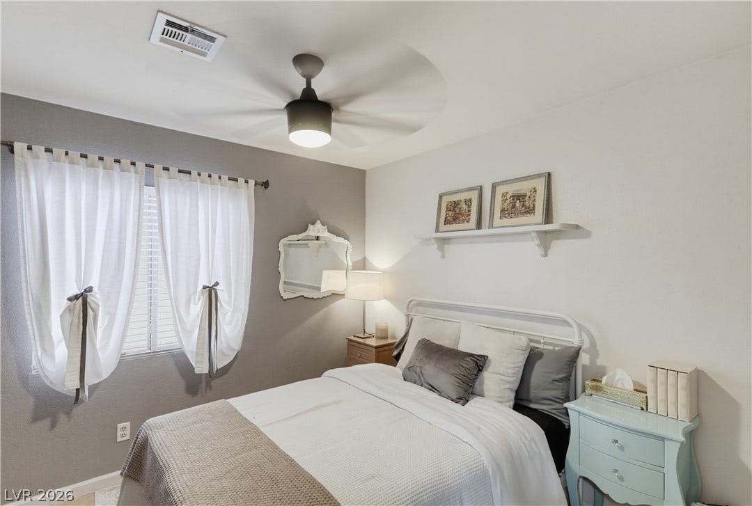 3211 Panamint Court, North Las Vegas, NV 89032 Natural light streams through well-proportioned windows in this inviting and comfortable bedroom.