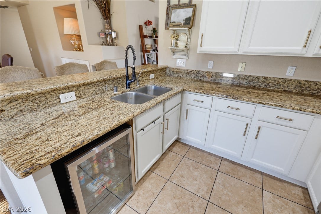 3211 Panamint Court, North Las Vegas, NV 89032 Granite countertops and clean tile flooring define this efficient culinary workspace.
