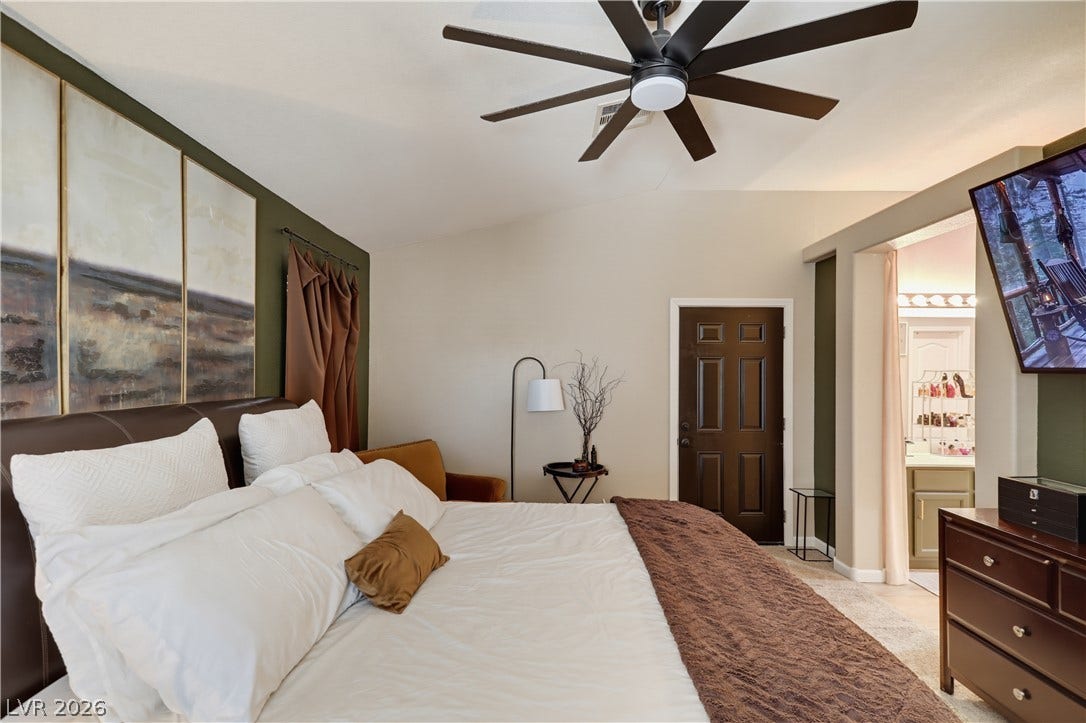 3211 Panamint Court, North Las Vegas, NV 89032 Vaulted ceilings and a private bathroom access define this relaxing bedroom retreat.