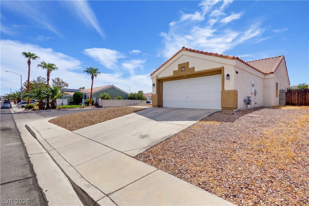 3211 Panamint Court, North Las Vegas, NV 89032 Spanish tile roofing and classic stucco exterior define this desert home.