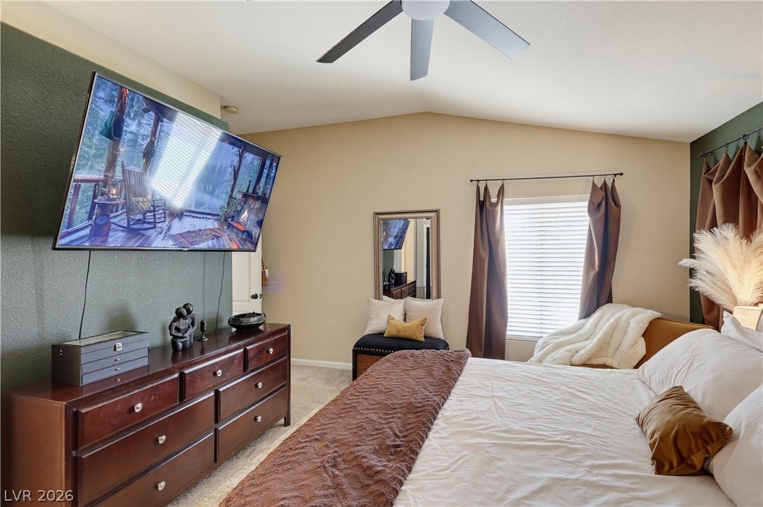 3211 Panamint Court, North Las Vegas, NV 89032 Vaulted ceilings and plush carpeting enhance this comfortable bedroom layout.