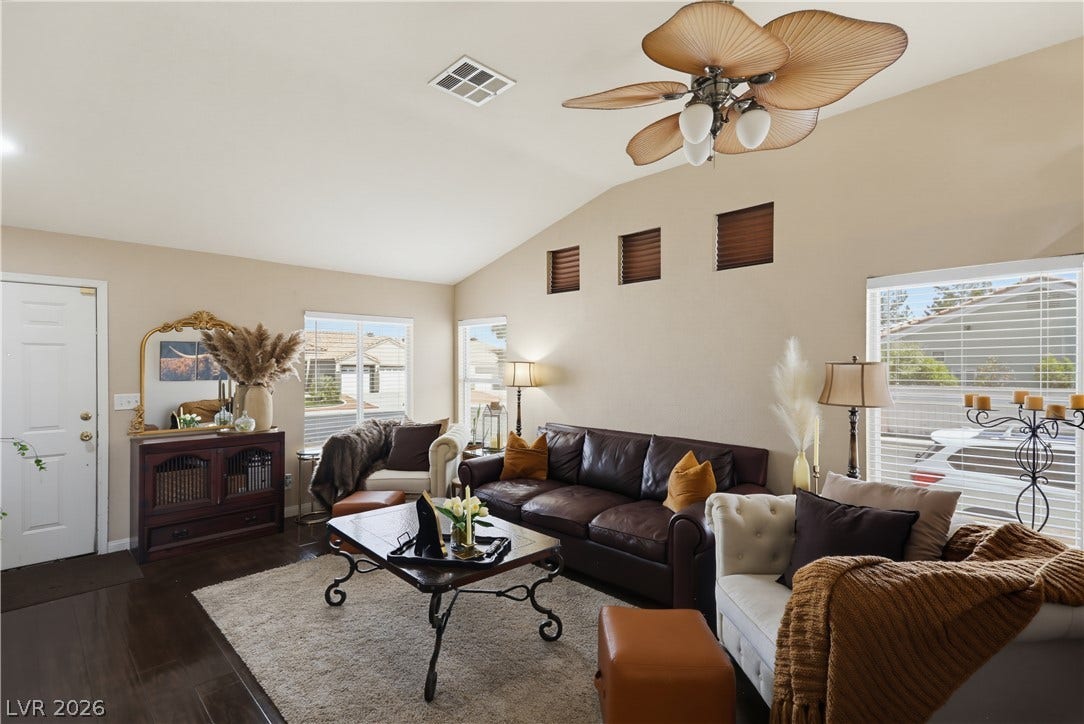 3211 Panamint Court, North Las Vegas, NV 89032 Vaulted ceilings and rich wood floors create a warm, inviting ambiance in this living area.