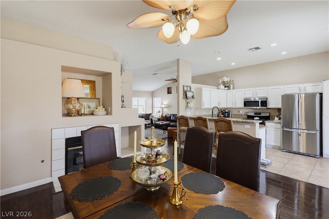 3211 Panamint Court, North Las Vegas, NV 89032 Polished floors and a tile fireplace mantel anchor this inviting open dining area.