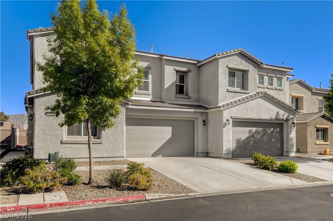 Crisp stucco elevation highlights this modern multi-level residence with a spacious two-car garage.
