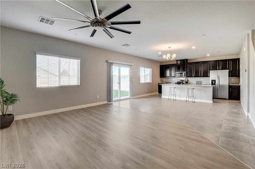 An open floorplan seamlessly connects the airy living area to the kitchen.