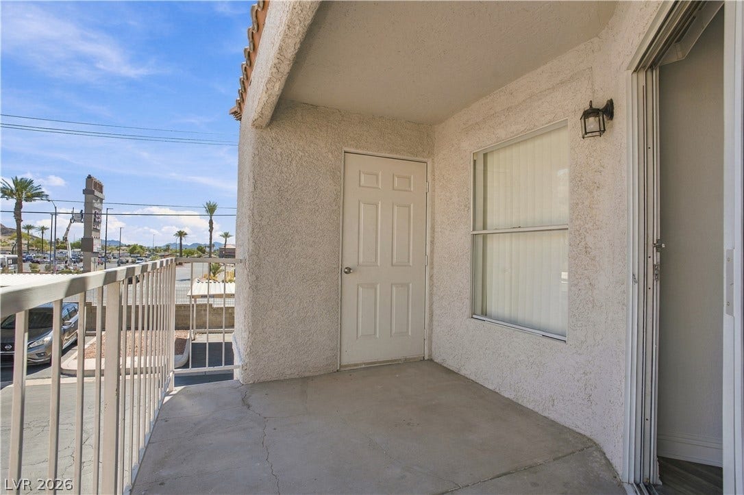 6800 Lake Mead, #2117, Las Vegas, NV 89156 A private covered balcony features durable concrete flooring and textured stucco walls.