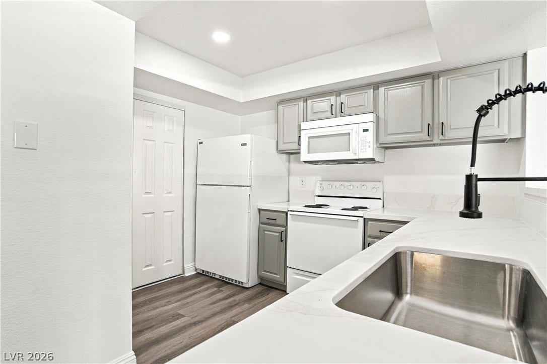 6800 Lake Mead, #2117, Las Vegas, NV 89156 Clean lines and durable stone counters define this modern workspace layout.
