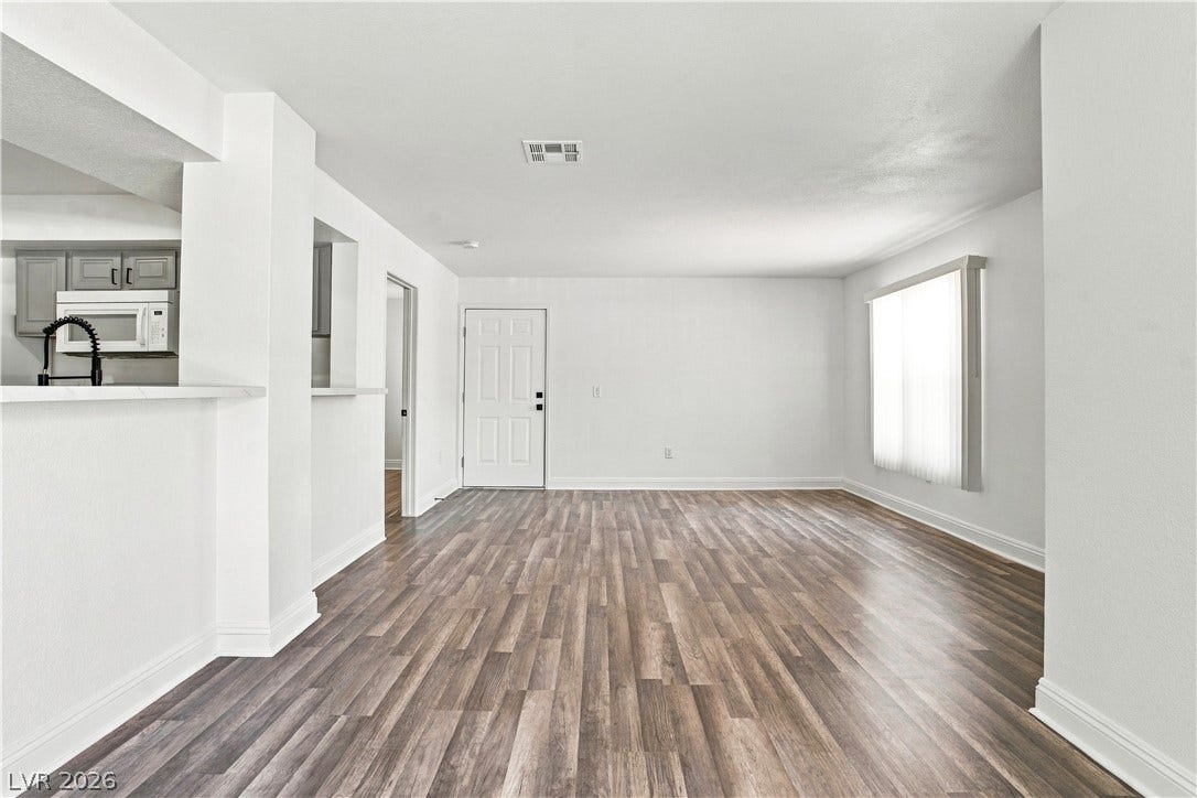 6800 Lake Mead, #2117, Las Vegas, NV 89156 Streamlined transitions connect the spacious main living areas with durable wood-look flooring throughout.