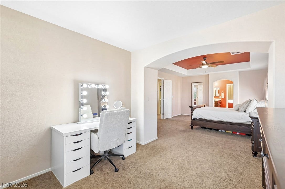 4024 Solar System Street, North Las Vegas, NV 89032 An arched opening separates the versatile dressing area from the comfortable primary bedroom suite.