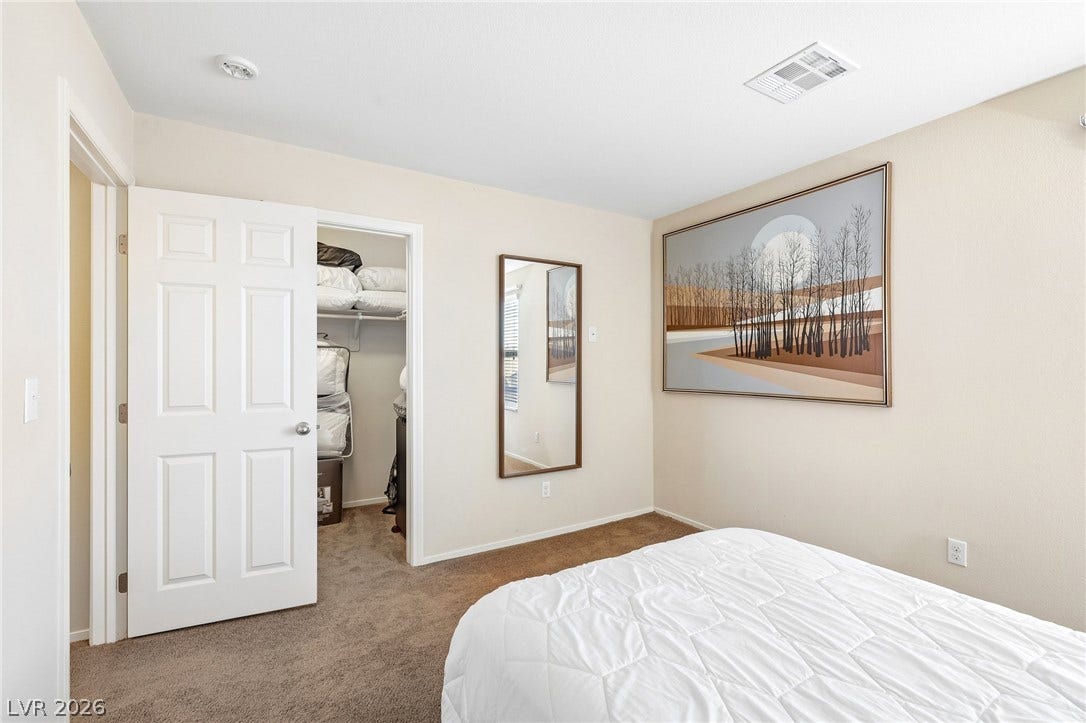 4024 Solar System Street, North Las Vegas, NV 89032 Plush carpeting and a walk-in closet highlight this comfortable bedroom space.