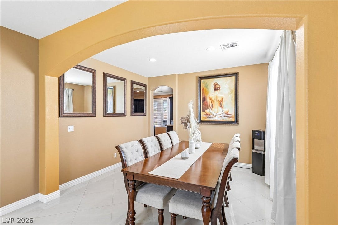 4024 Solar System Street, North Las Vegas, NV 89032 Gleaming tile floors and architectural archways define this elegant, formal dining space.