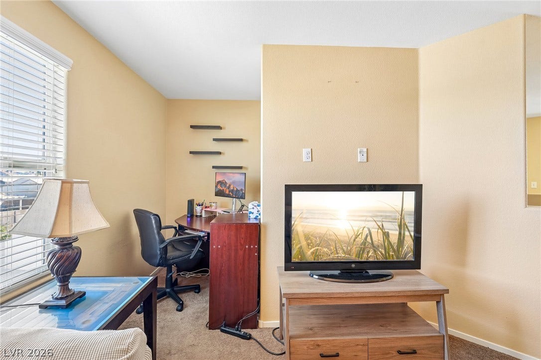 4024 Solar System Street, North Las Vegas, NV 89032 A quiet work alcove sits beside a window with fitted blinds.
