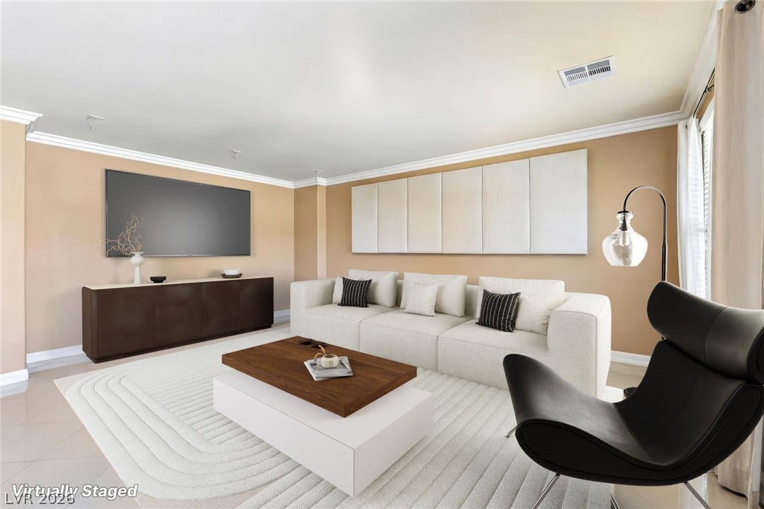 4024 Solar System Street, North Las Vegas, NV 89032 Elegant crown molding and modern tile flooring define this spacious living area.
