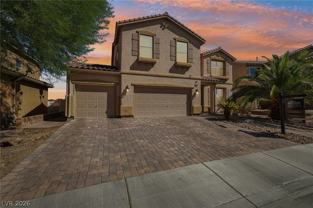 4024 Solar System Street, North Las Vegas, NV 89032 A spacious paver driveway leads to the multi-car garage of this multi-level home.