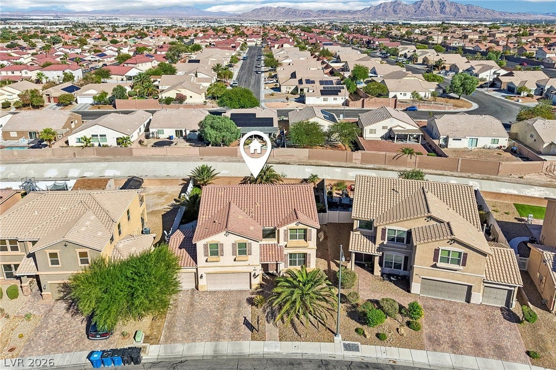 4024 Solar System Street, North Las Vegas, NV 89032 Distant mountain backdrops frame this residential community of classic tile-roof homes.
