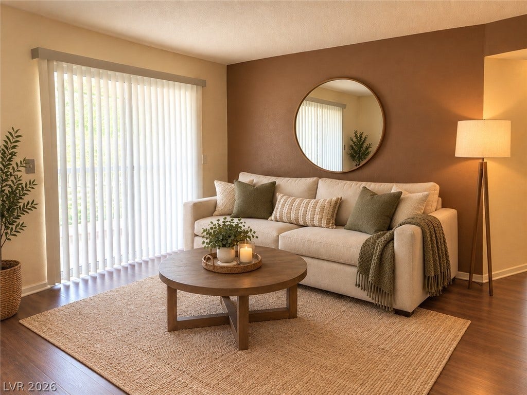 3550 Bay Sands Drive, #1017, Laughlin, NV 89029 VIRTUALLY STAGED. A glass sliding door opens to the outside from this warm living area.