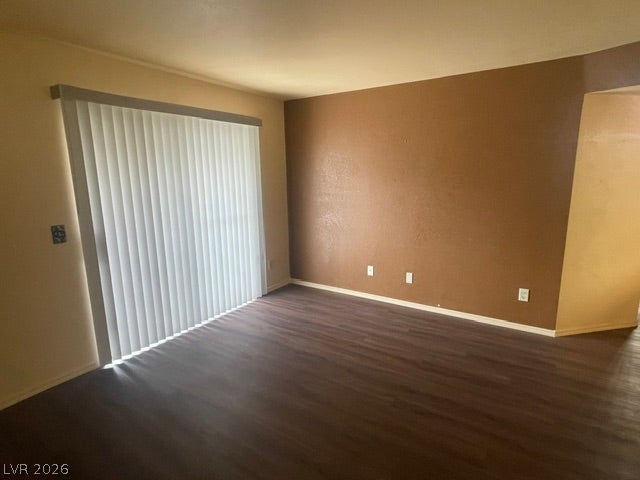 3550 Bay Sands Drive, #1017, Laughlin, NV 89029 Rich wood-look flooring anchors this open living space featuring a sliding glass door.