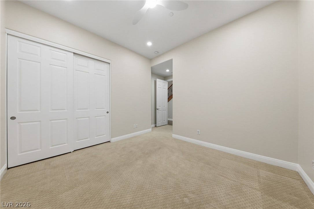 1357 Enchanted River Drive, Henderson, NV 89012 Plush carpeting and recessed lighting create a comfortable atmosphere in this versatile space.