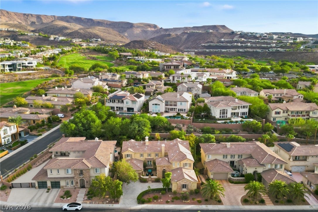 1357 Enchanted River Drive, Henderson, NV 89012 Nestled below majestic desert mountains, this hillside community features elegant tile-roof homes.
