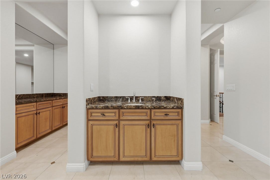 1357 Enchanted River Drive, Henderson, NV 89012 Polished stone counters and clean tile flooring define this elegant alcove space.