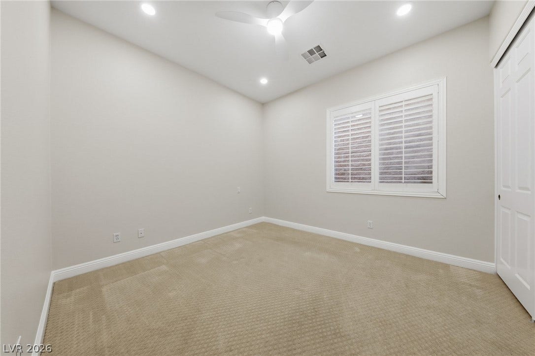 1357 Enchanted River Drive, Henderson, NV 89012 Plush carpeting and plantation shutters define this versatile secondary room.