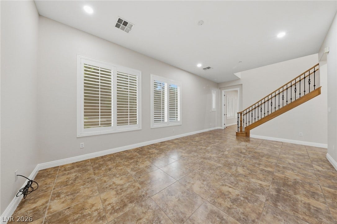 1357 Enchanted River Drive, Henderson, NV 89012 High ceilings and durable tile flooring define this versatile entry space complete with plantation shutters.