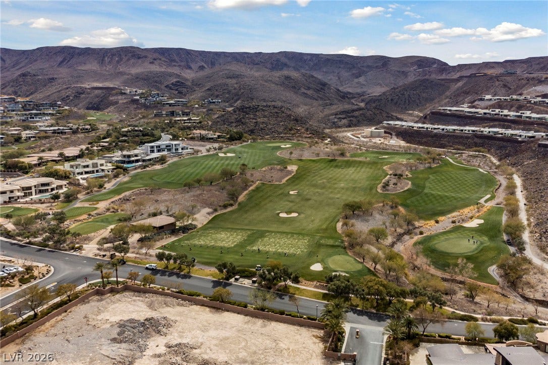 1357 Enchanted River Drive, Henderson, NV 89012 Dramatic mountain views frame the lush fairways of the surrounding golf course community.