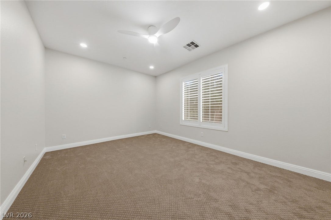 1357 Enchanted River Drive, Henderson, NV 89012 Plush carpeting and plantation shutters highlight this versatile secondary bedroom space.