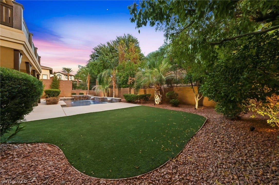 1357 Enchanted River Drive, Henderson, NV 89012 Lush landscaping and an inviting swimming pool define this private backyard oasis.