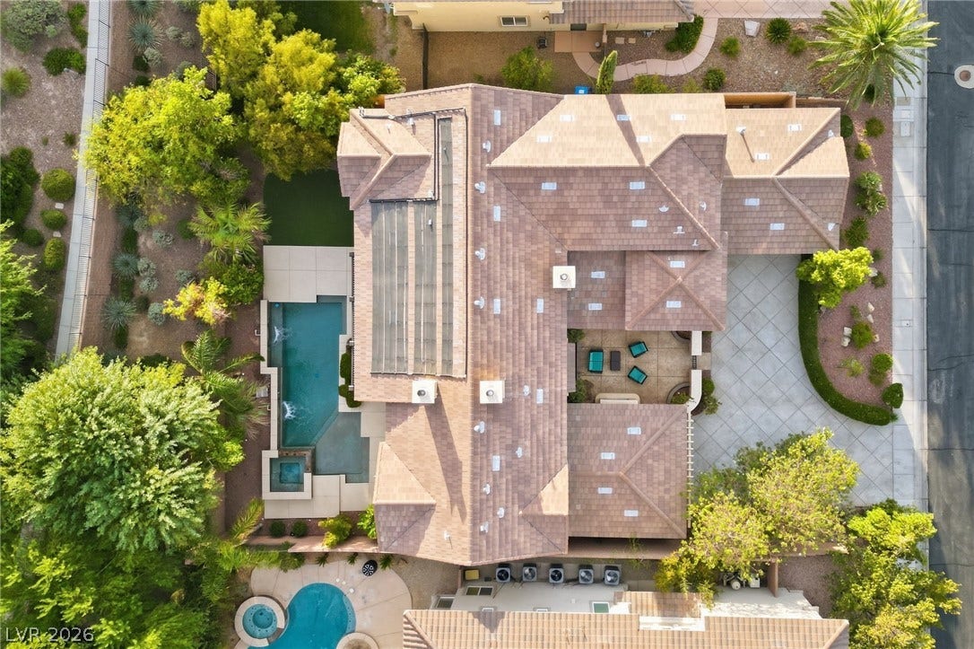 1357 Enchanted River Drive, Henderson, NV 89012 An aerial perspective showcases a meticulously designed estate complete with a pool and courtyard.